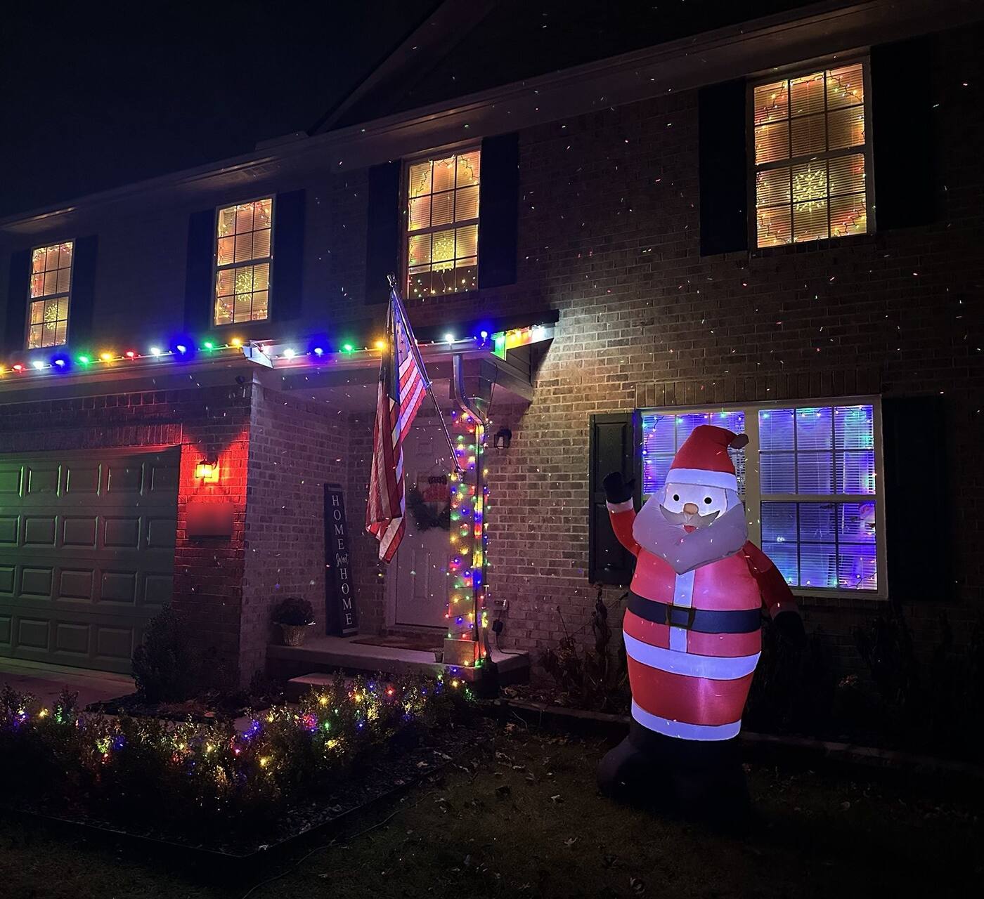 Holiday lights on a brick colonial