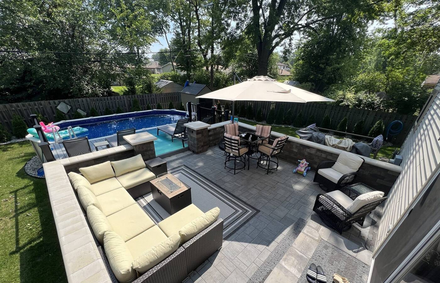 Oberfield paver patio by the pool with Edington seat walls and a sailor border