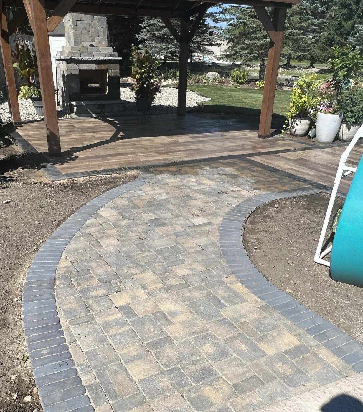 Curved paver walk to the fireplace